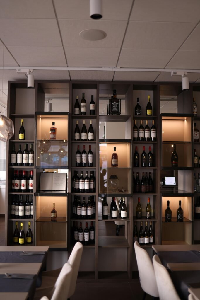 Stylish wine display shelving in a contemporary restaurant interior.