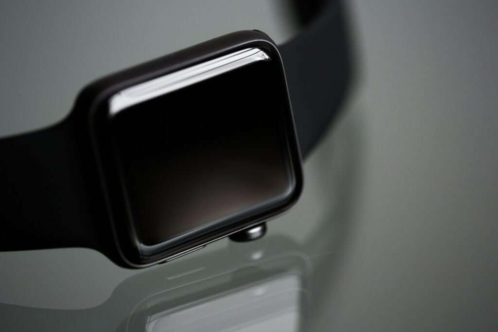 Detailed close-up of a stylish modern smartwatch with a black band, ideal for tech enthusiasts.