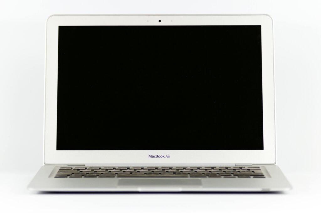 Front view of a MacBook Air laptop with a blank screen on a white background.